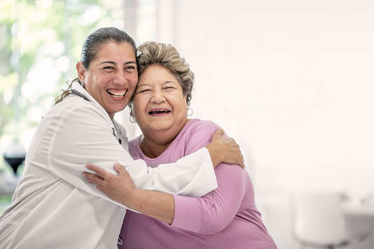 A woman hugging her doctor