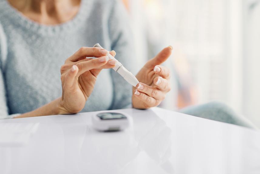 A person checking their blood sugar level