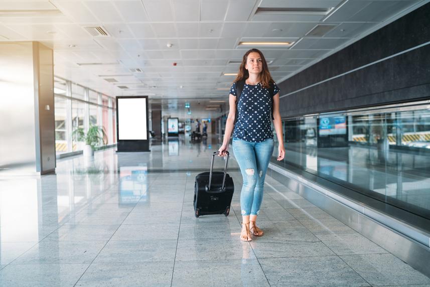 Person in airport experiencing jet lag