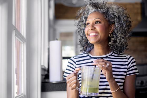 Woman drinking immunity boosting drink