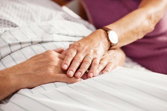 Close-up of woman's hand holding man's hand