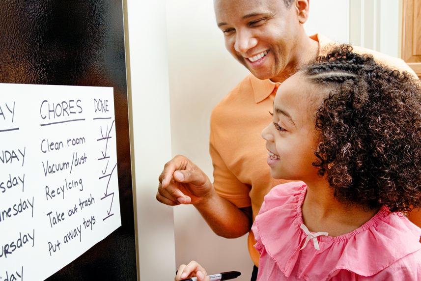 Parent helping his daughter with ADHD