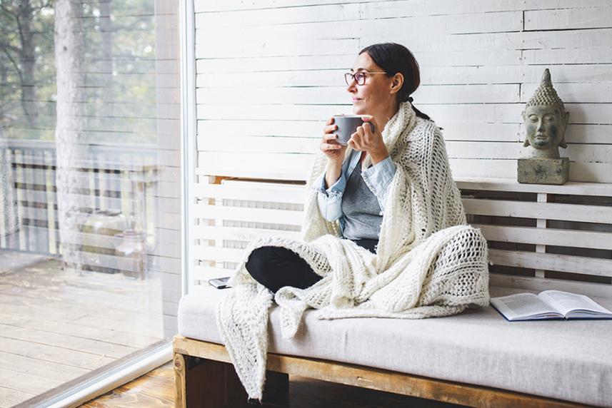 Person drinking a cup of coffee