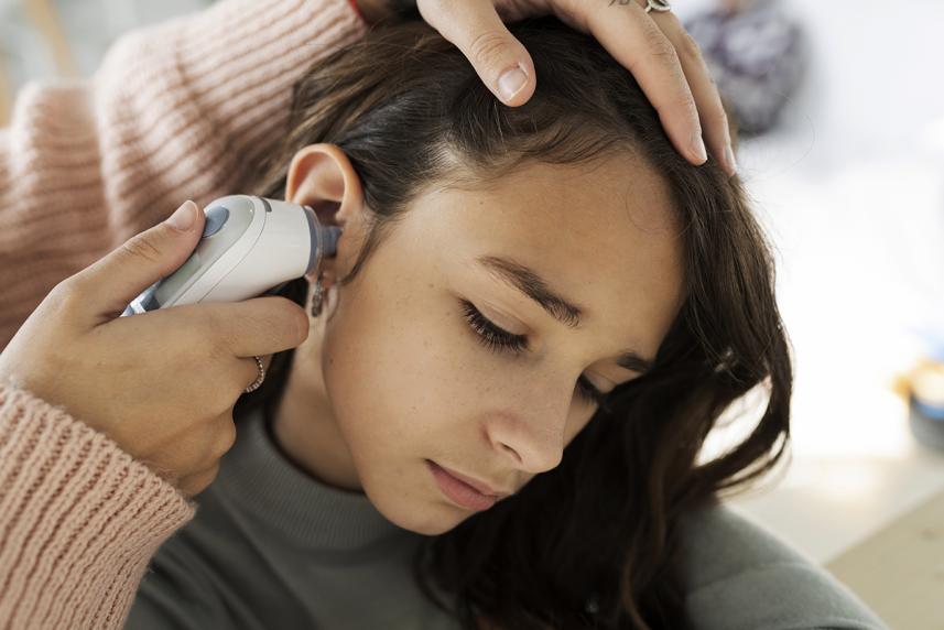 Doctor taking patients temperature