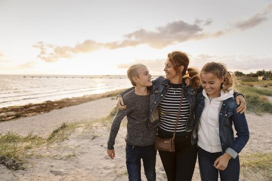 A family walking together on the beach