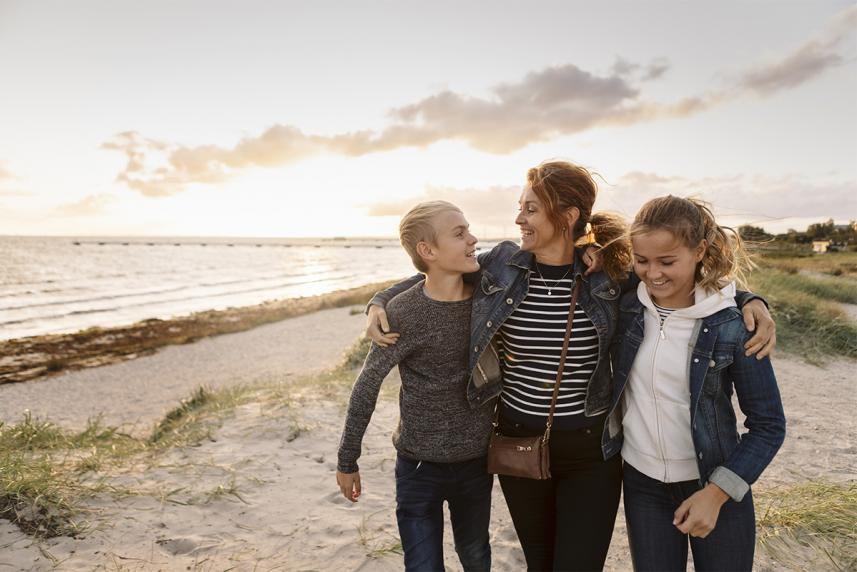 A family walking together on the beach