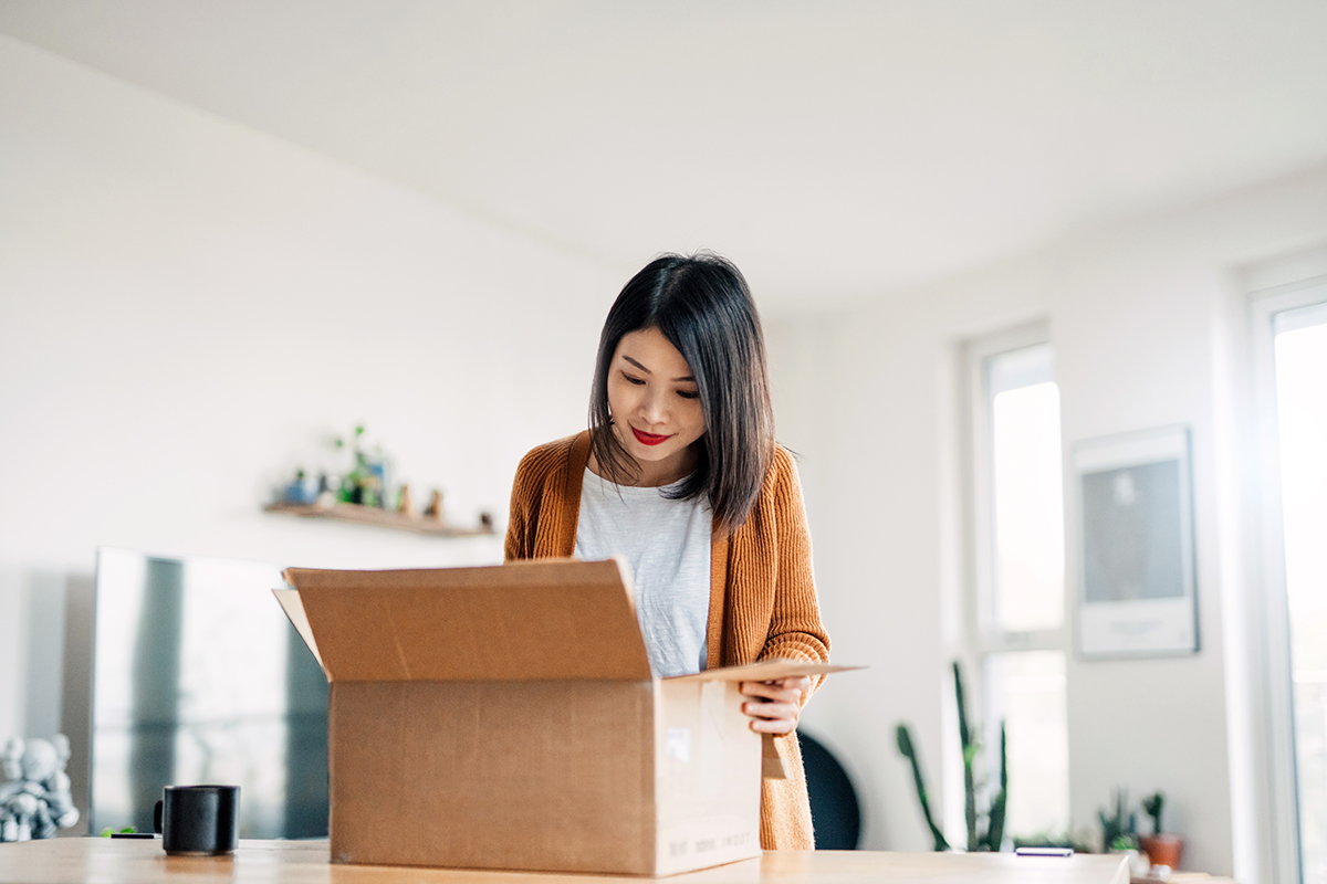 Woman opening a box of health essentials